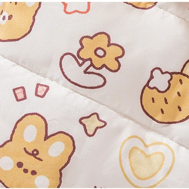 Yellow quilted cotton four-legged dog coat with sherpa hood and bear print on white background