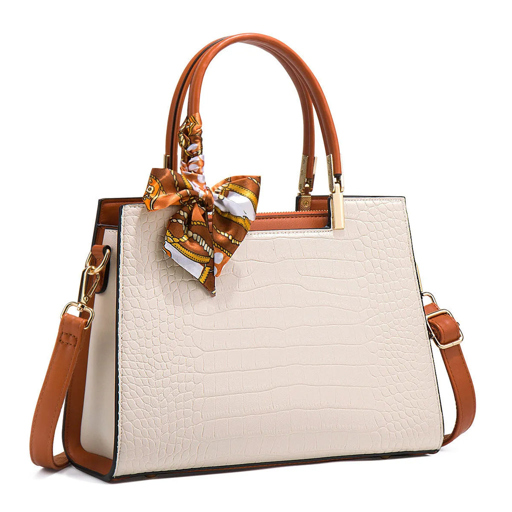Milky white women's shoulder handbag with horizontal square shape showing internal organiser compartments