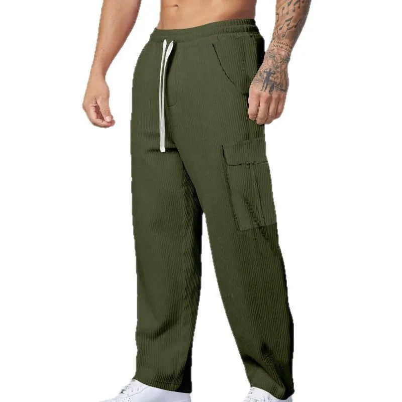 Men's navy blue corduroy cargo trousers with a drawstring waist and straight wide-leg cut on a hanger.