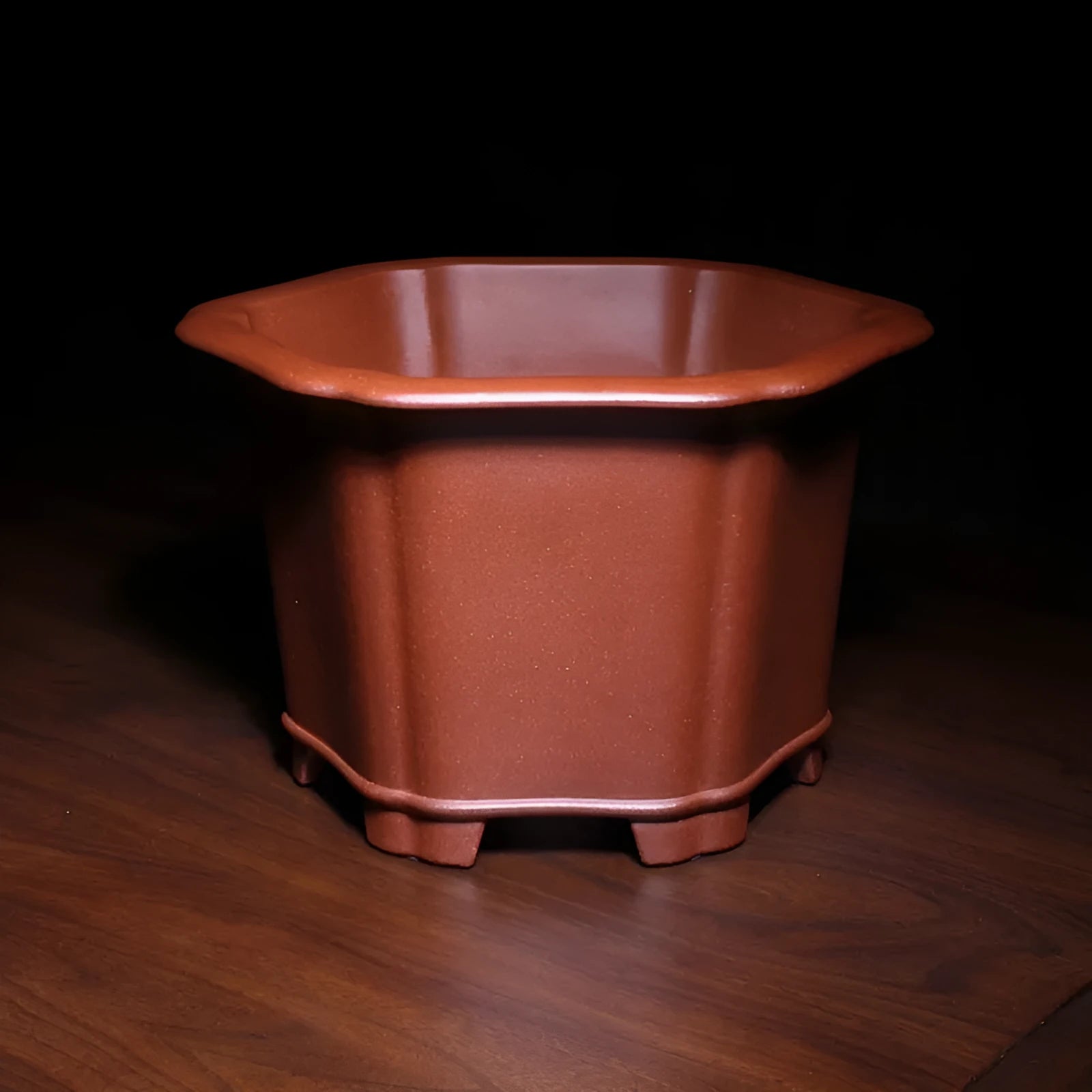 Square blue descending slope mud Zisha ceramic flowerpot on desktop with a plant