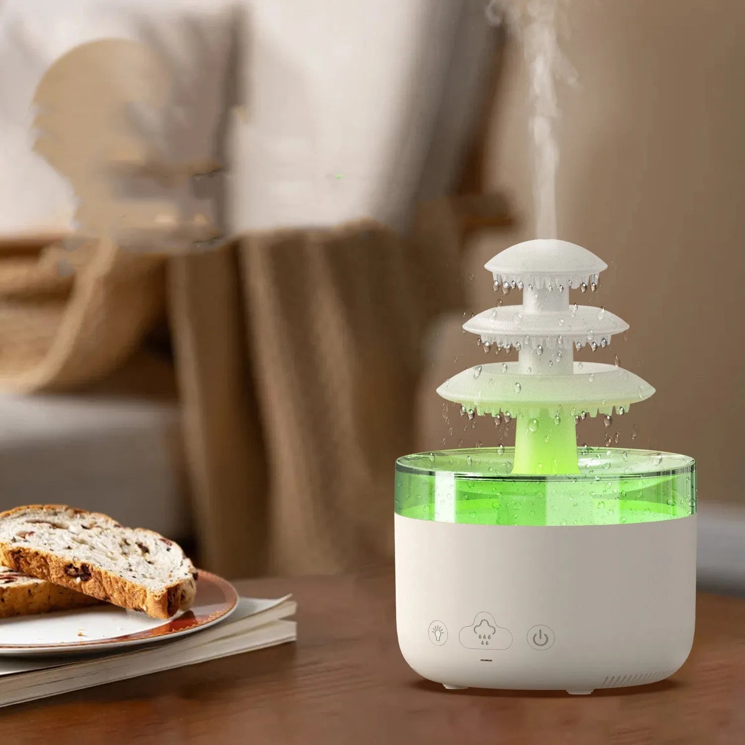 White cloud-shaped USB humidifier and essential oil diffuser with LED lights on a table