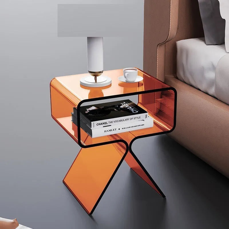Transparent acrylic side table with bracket frame in living room setting