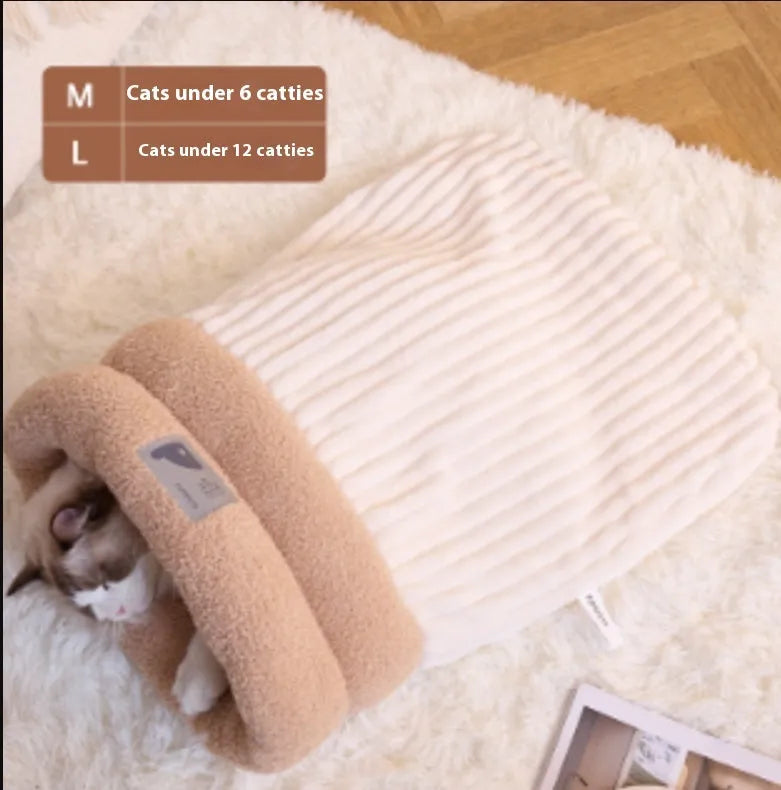 Brown semi-enclosed lambswool cat sleeping bag on a wooden floor.