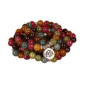 108 bead multi-layer bracelet in tourmaline colour with alloy details on a wrist.
