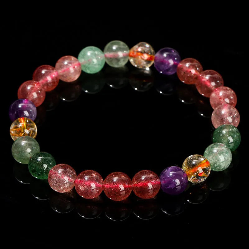 Natural strawberry quartz bracelet with round beads in 7mm, 8mm, or 9mm sizes.