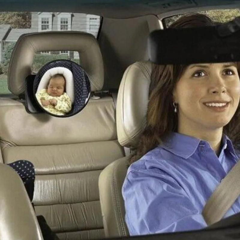 Black ABS baby safety seat rearview mirror with circular 17cm glass and adjustable strap on car headrest.