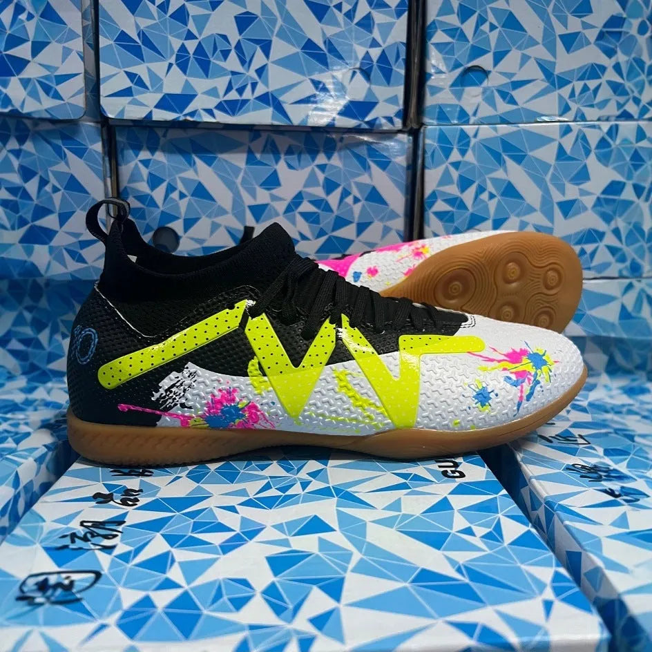 Low-top football boots in black and yellow with a PVC upper and non-slip rubber studded outsole.