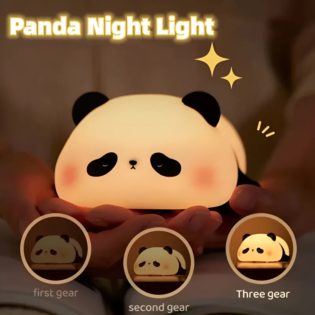 Cartoon panda head shaped silicone night light for children on a bedside table.