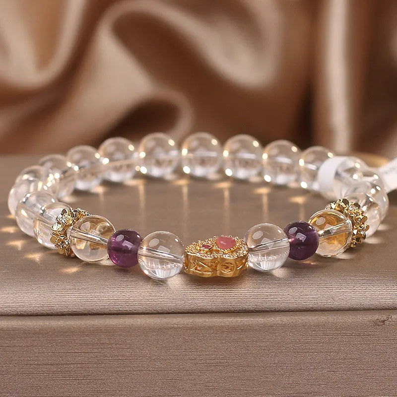 Natural white crystal bracelet for women with transparent gourd detail on light background