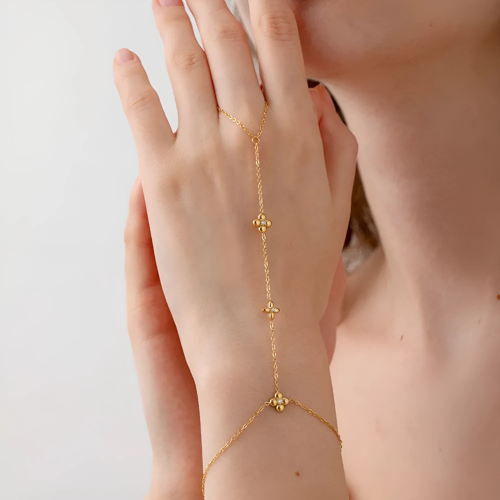 Gold geometric women's bracelet with floral and eight-pointed star design on stainless steel