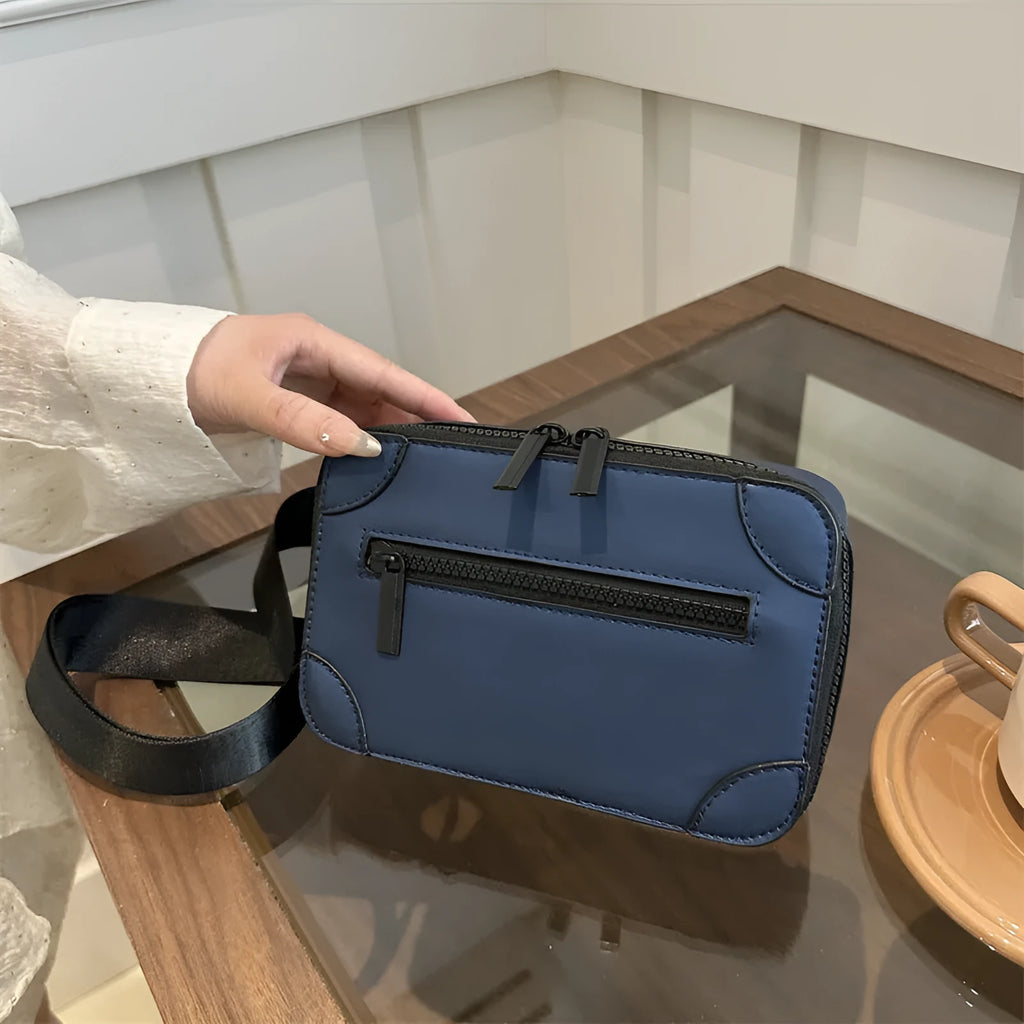 Women's small square crossbody bag in PU leather, horizontal shape, shown in one of five colours with visible sewing lines.