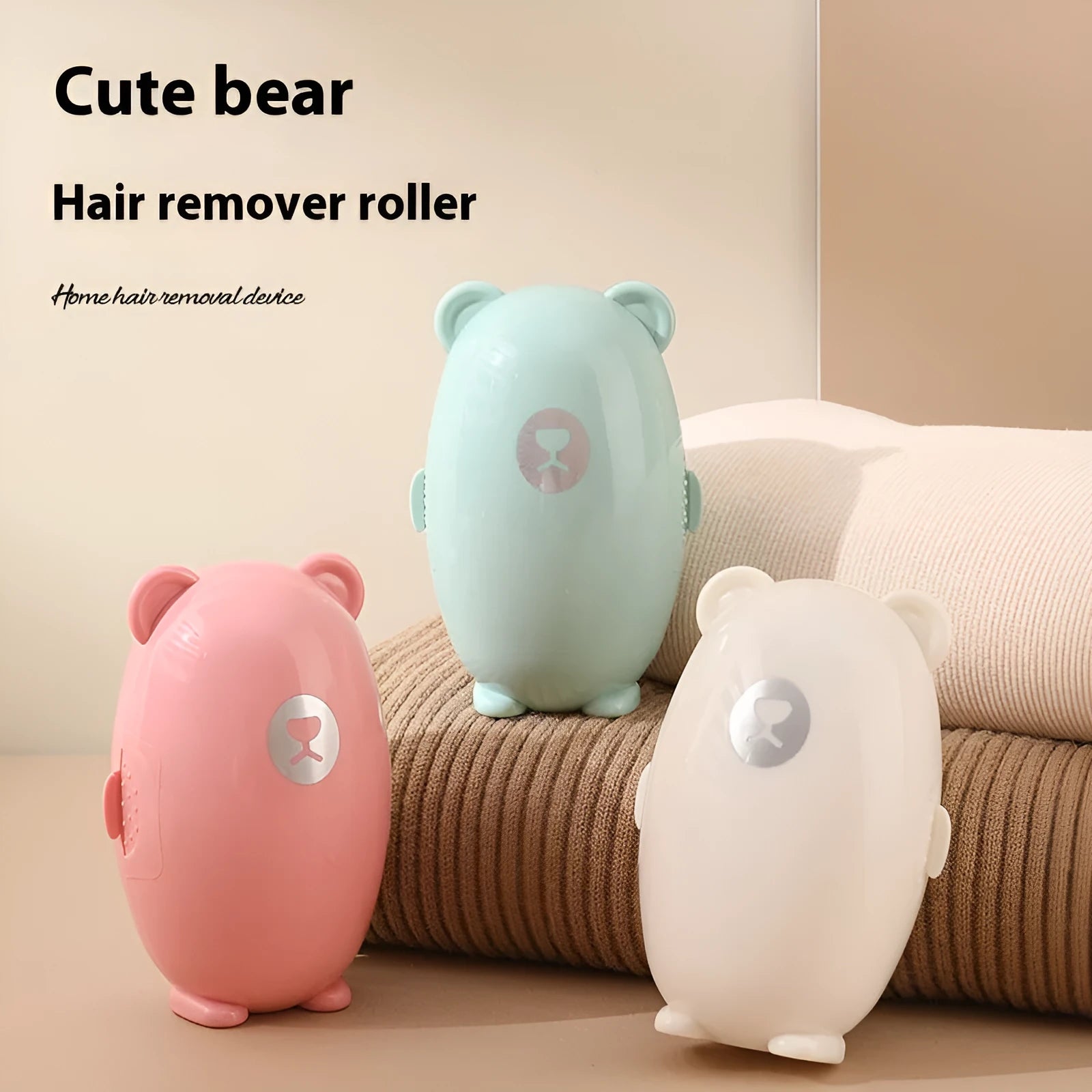 Green sticky lint remover roller with a modern plastic handle on a fabric background.