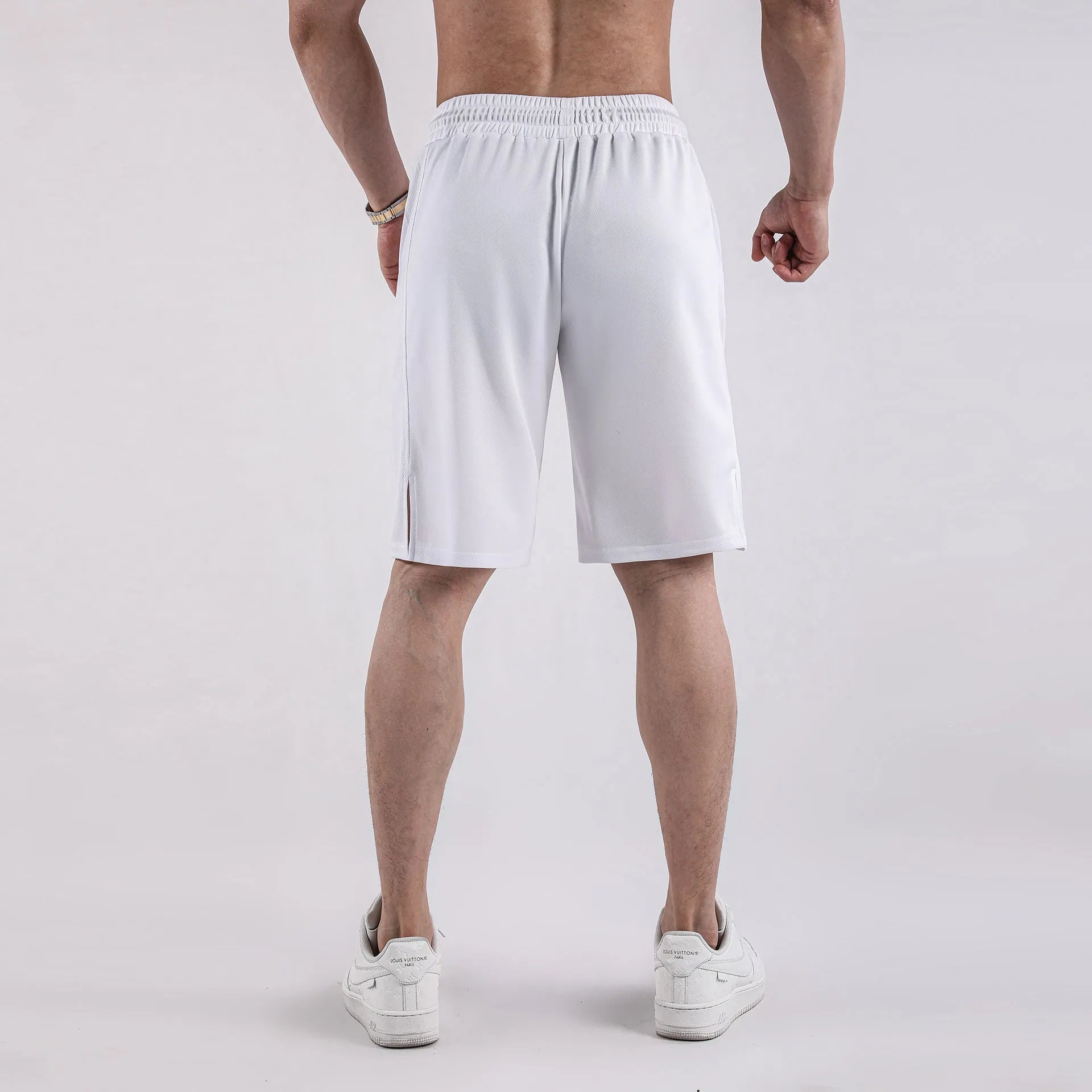 Men's black quick-drying mesh fitness shorts with a loose fit and elastic waist.