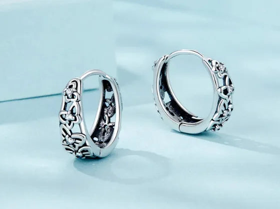 Sterling silver retro hollow butterfly earrings with zircon stones measuring 14mm x 5mm