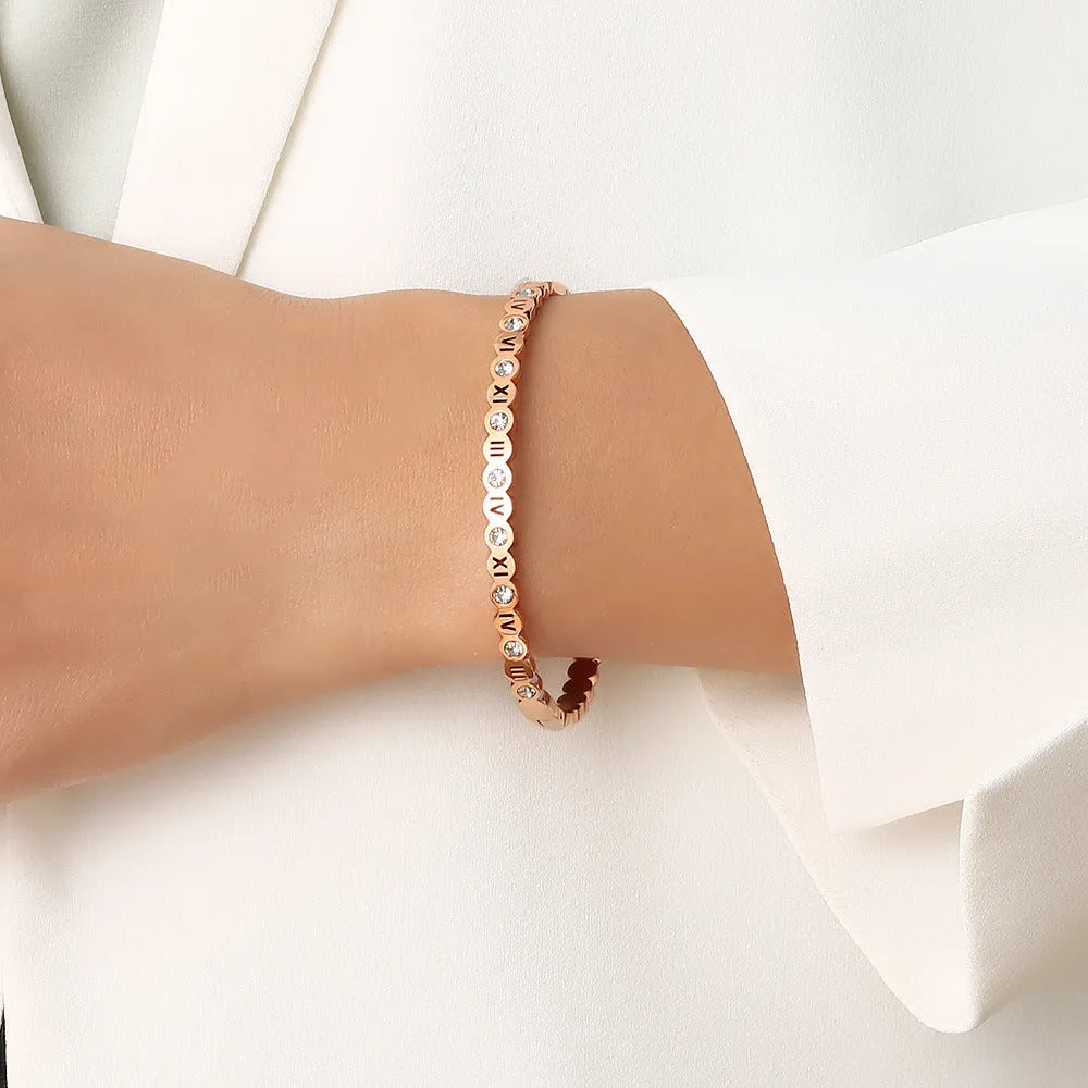 Korean style titanium steel bracelet with electroplated finish in gold, rose gold or steel colour with number charm detail