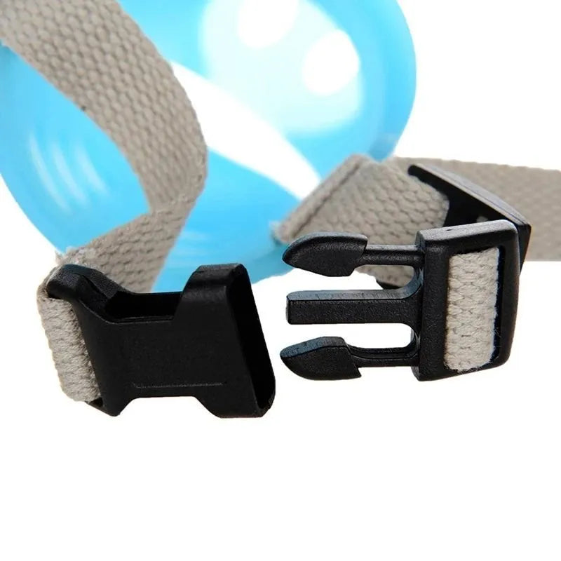 Green silicone anti-bite mouth cover for dog with long snout, showing size comparison
