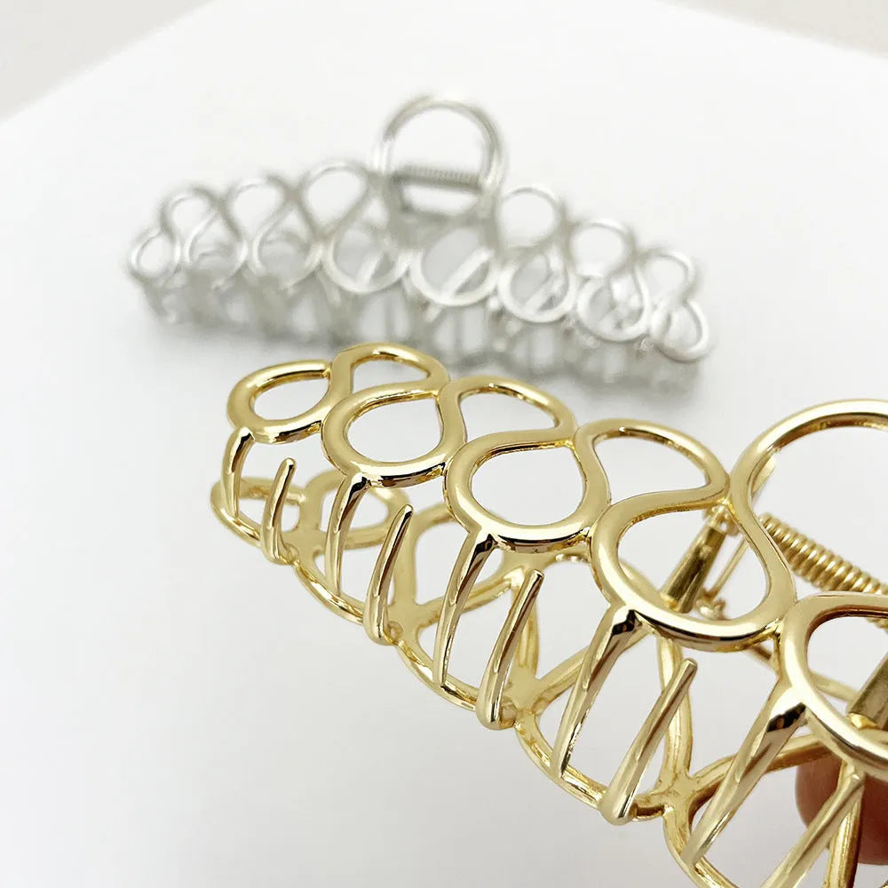 Minimalist large updo hair clip with tassel detail in gold or silver electroplated alloy