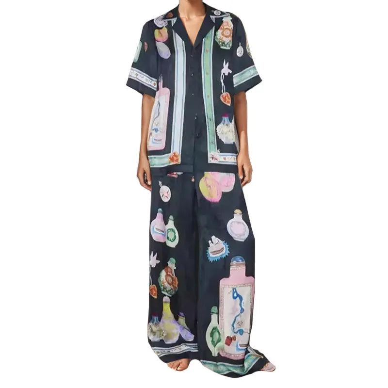Black women's cardigan and trouser set with cartoon animation print.