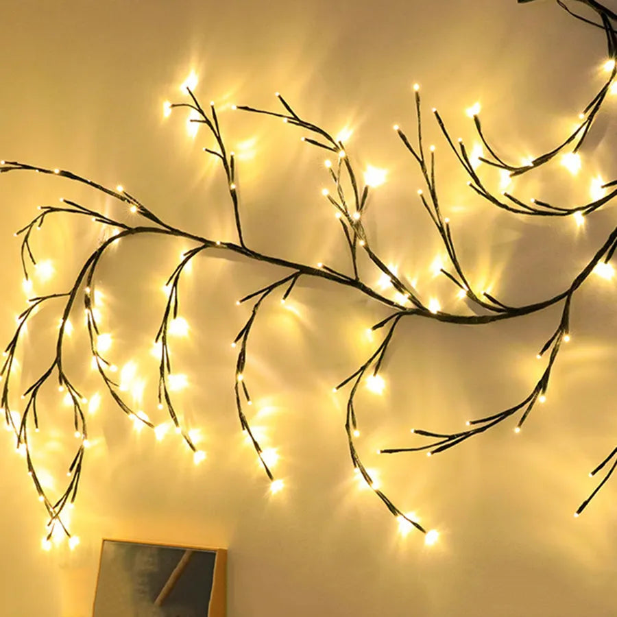 Flexible willow vine LED Christmas garland light with warm white lights on white birch texture branches