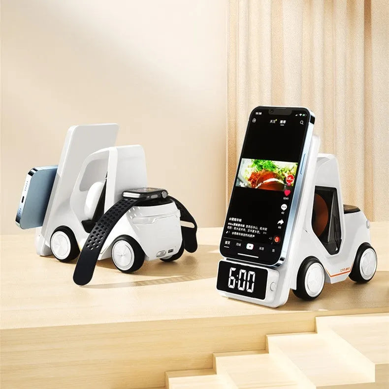 Grey triple wireless charging bracket mounted on a car air vent, charging a phone, smartwatch, and earbuds.