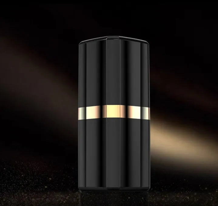 Fashion lipstick case open to show black Bluetooth earbuds with in-ear design.