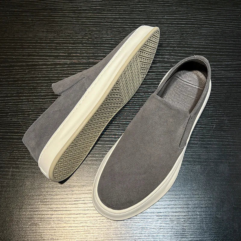 Gray men's casual slip-on shoes with round toe and mid heel on a white background