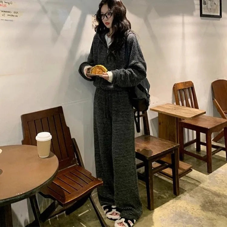 Two-piece sweatshirt and wide leg pants set in stripes or plaid pattern, conventional sleeves, sizes L to 4XL