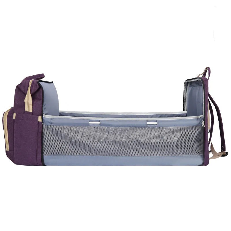 Lightweight nylon mummy bag with USB port and curved shoulder strap in multiple colour options.