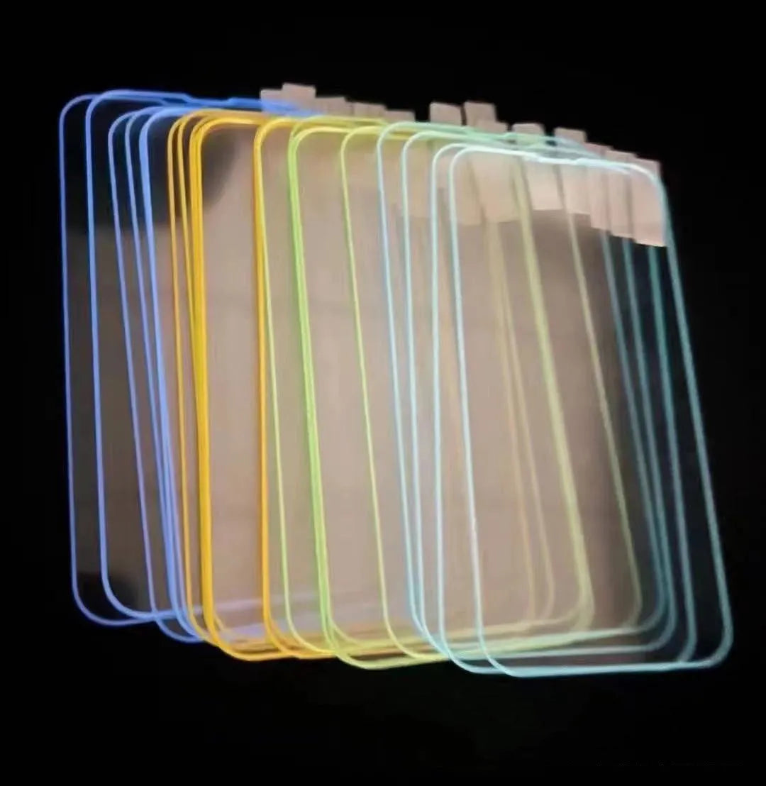 Fluorescent blue tempered glass screen protector glowing on an iPhone 13 in a dark setting.