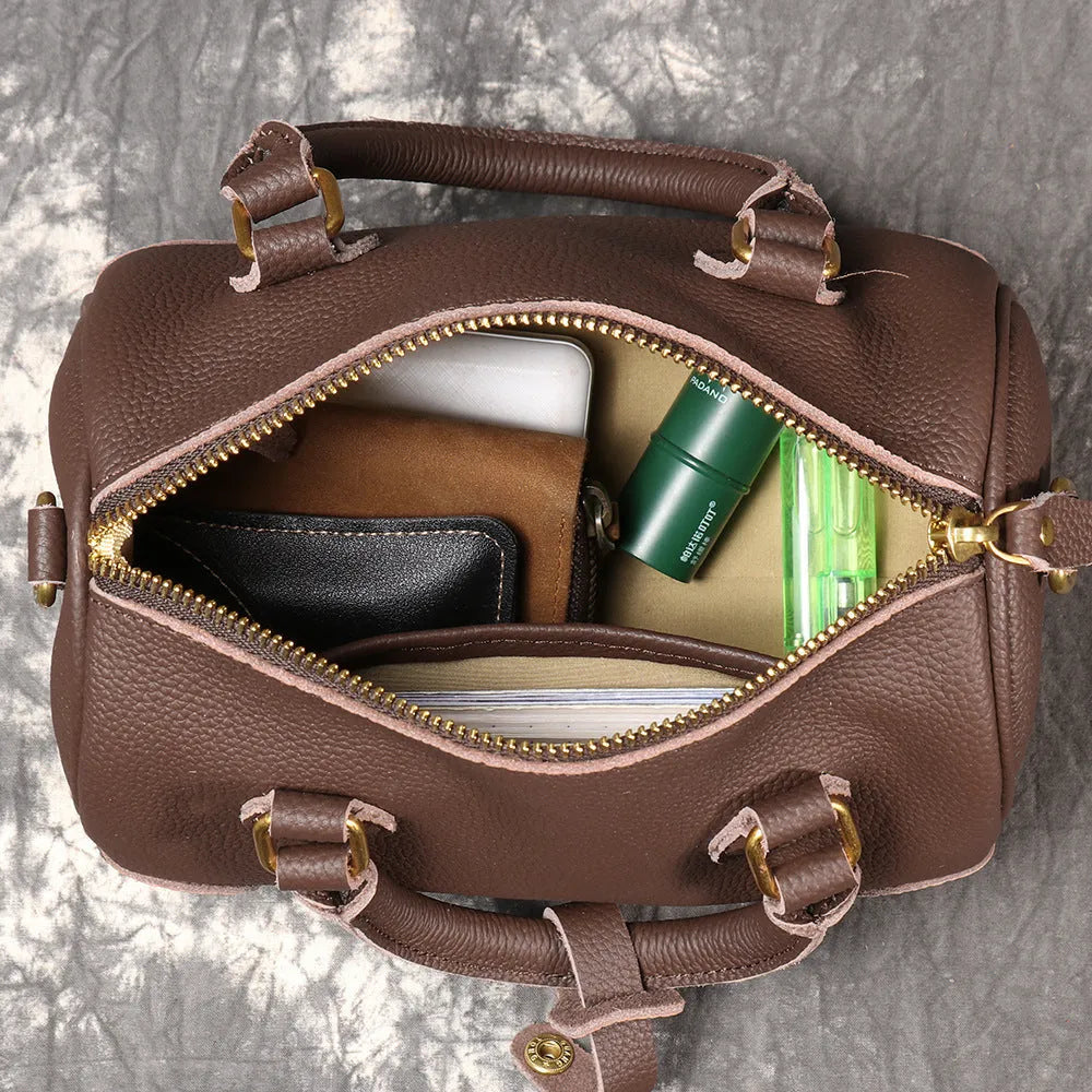 Brown handmade cowhide leather Boston bag with cylindrical shape and single shoulder strap
