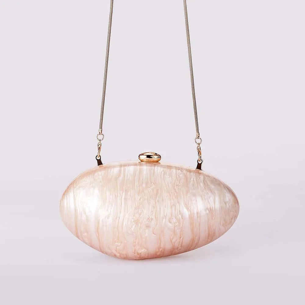 Acrylic oval crossbody bag shown in black with chain strap and hard shell