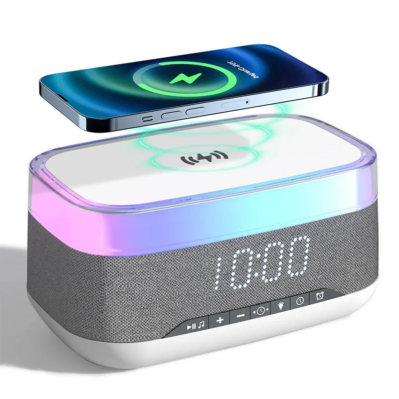 White multifunctional alarm clock with Bluetooth speaker and wireless charging pad on wooden table