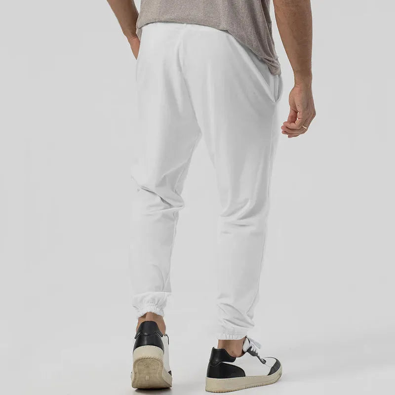 Men's grey straight-leg casual sweatpants with an elasticated waistband on a neutral background.