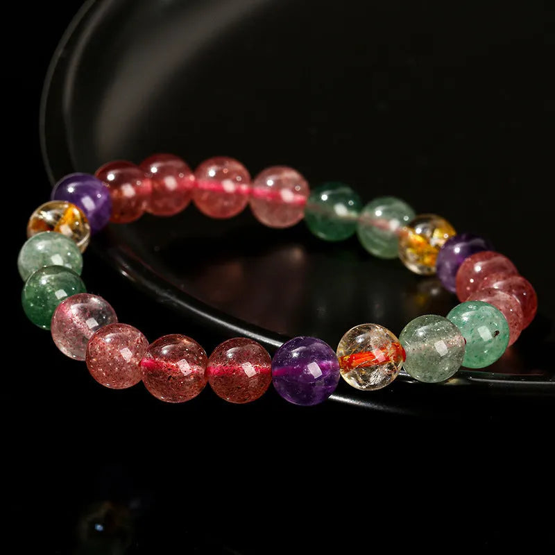 Natural strawberry quartz bracelet with round beads in 7mm, 8mm, or 9mm sizes.