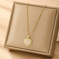 Women's electroplated copper necklace showing four pendant options: heart, butterfly, cross and round diamond designs