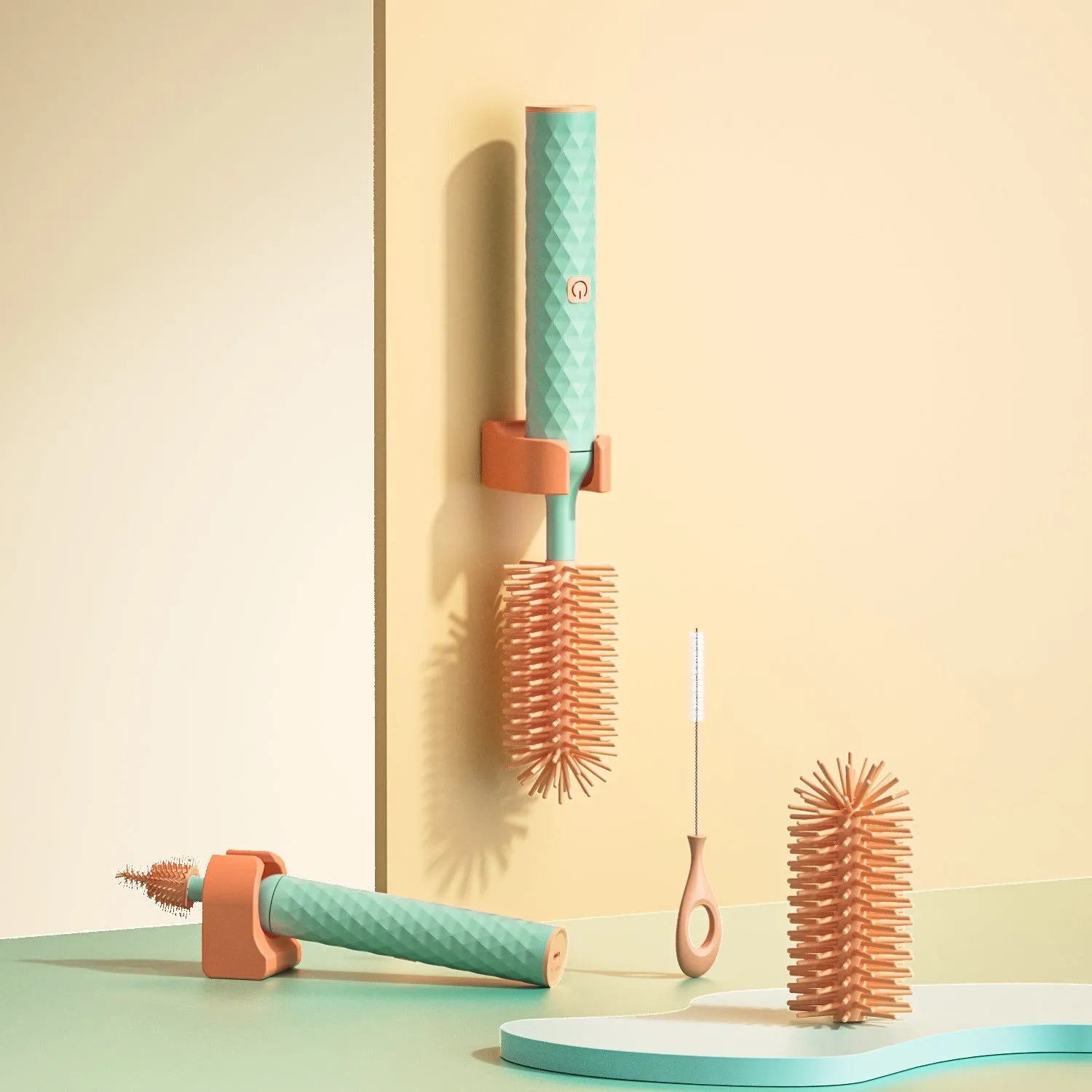 Pink and green electric rotating bottle cleaning brush with silicone bristles on a white background.