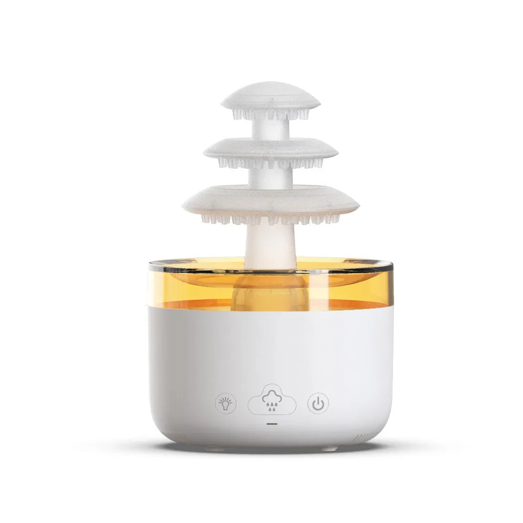White cloud-shaped USB humidifier and essential oil diffuser with LED lights on a table