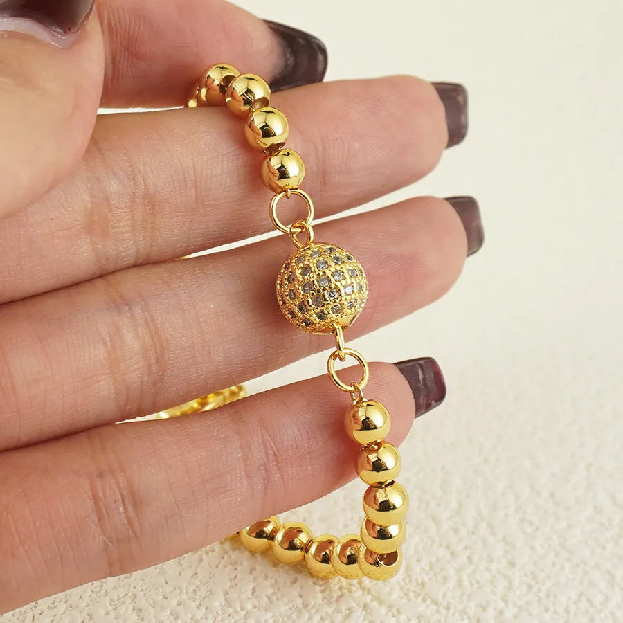 Women's copper bracelet with a heart-shaped design and a single ball zircon detail.