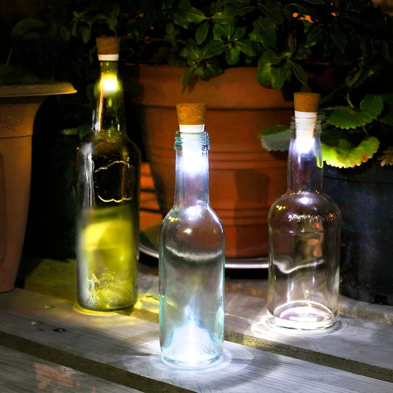 White plastic USB-rechargeable LED cork light for inserting into wine bottle neck.
