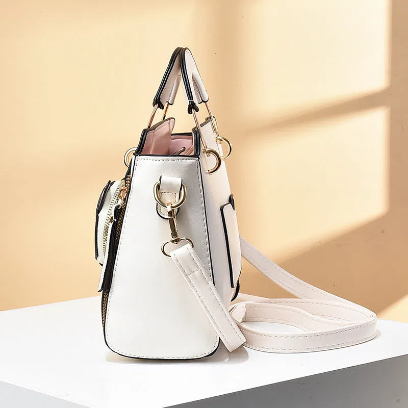 Cute cat design large-capacity shoulder bag in PU with six colour options and zip pocket.