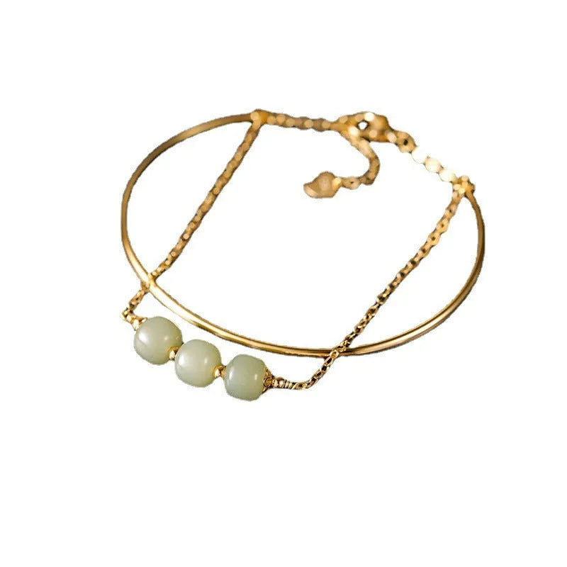 Women's Hetian jade lucky beads bracelet with gold inlay in a fake two pieces style.