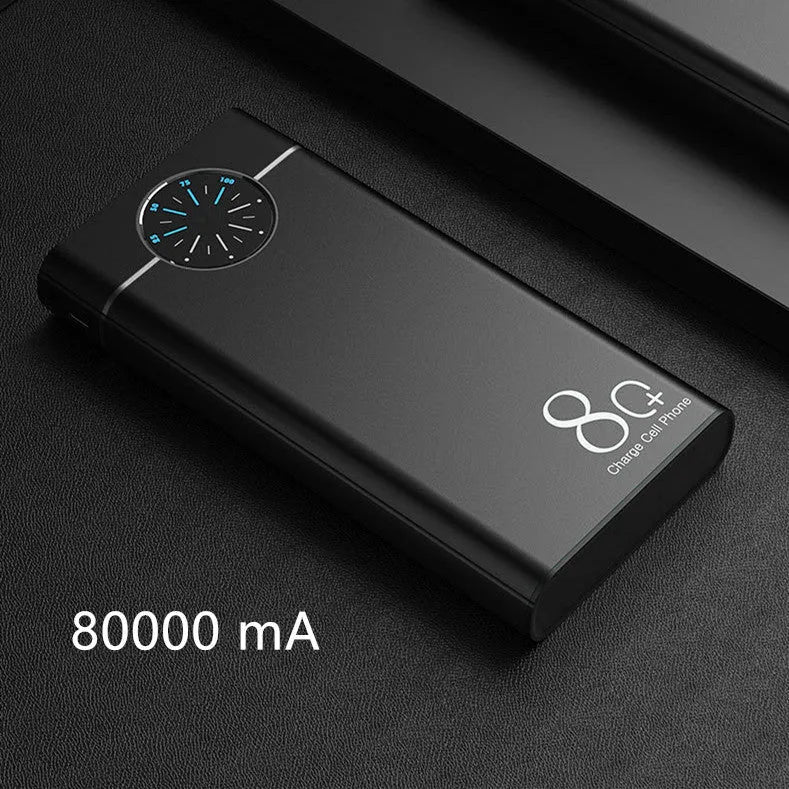Black 20000mAh alloy portable power bank with LED flashlight showing size scale