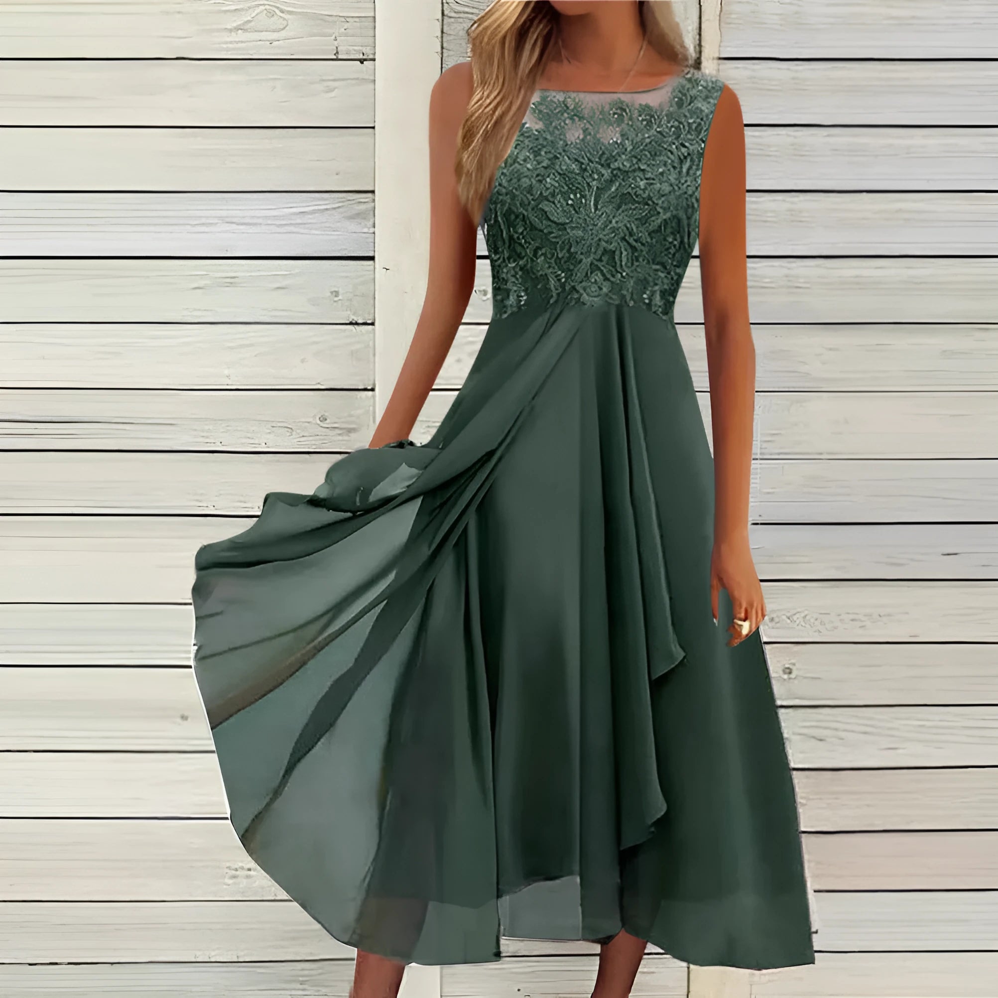 Women's sleeveless lace and chiffon dress in a princess style, shown in green colour.