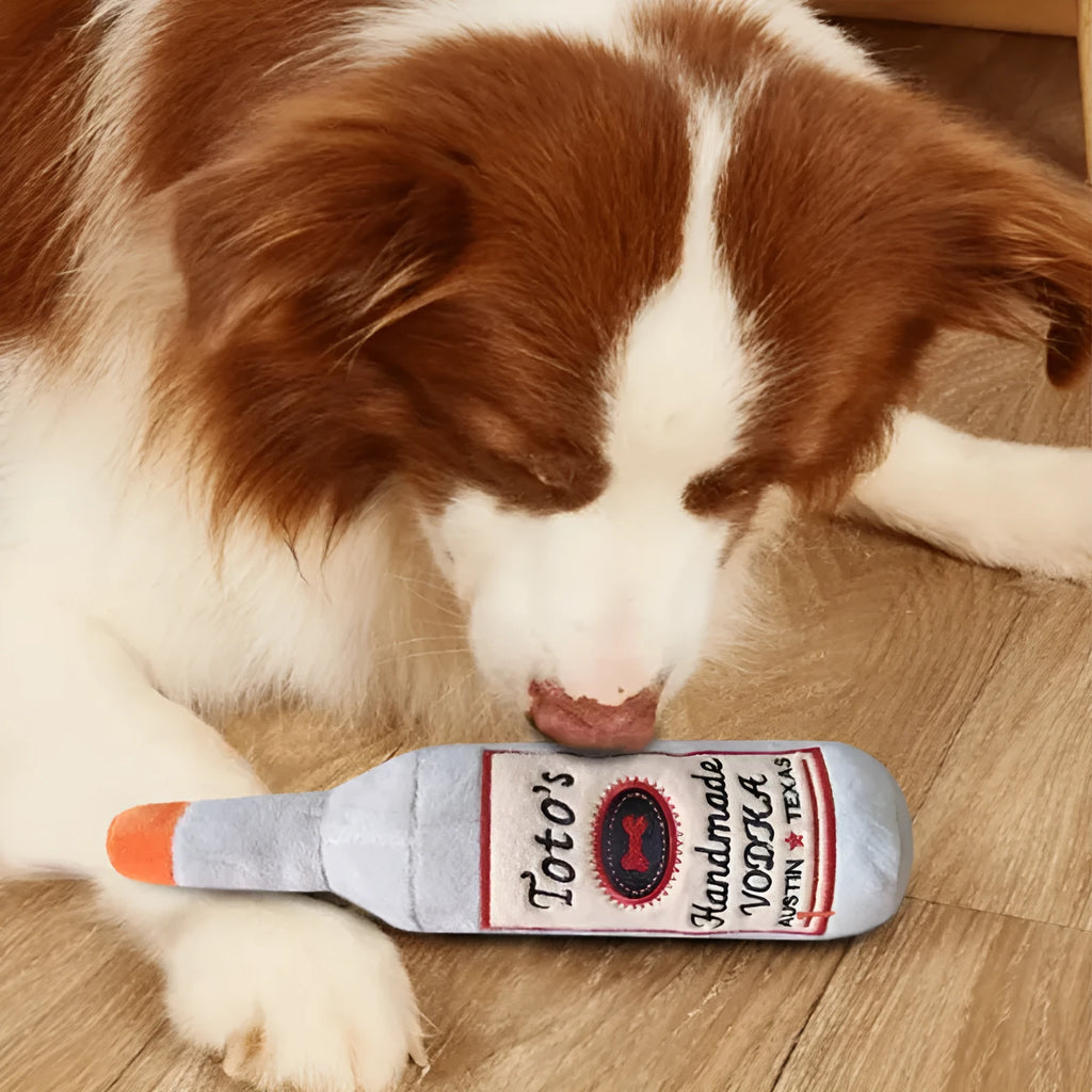Brown plush wine bottle shaped dog toy with squeaker