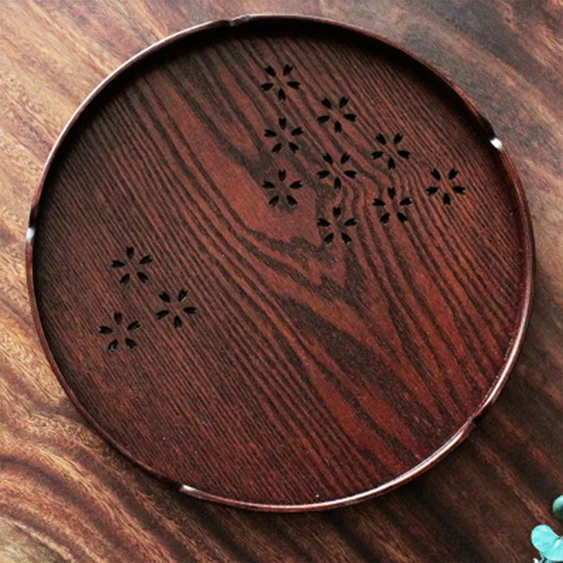 Wooden shallow plate with carved hollow cherry blossom pattern, 30cm in diameter.