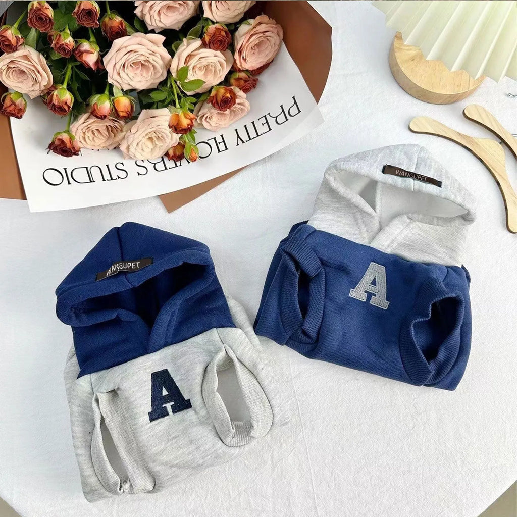 Blue and grey white polyester pet hoodie with reflective lettering on a cat or dog