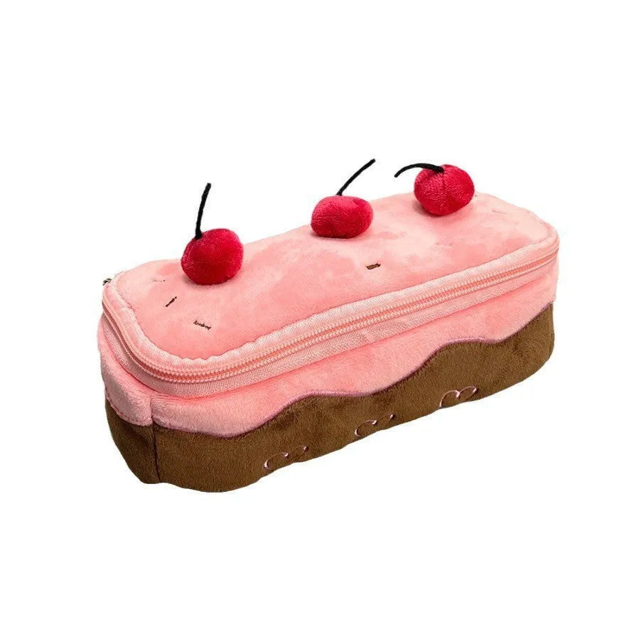 Soft red velvet pencil bag with a cherry cake print and a white zip.
