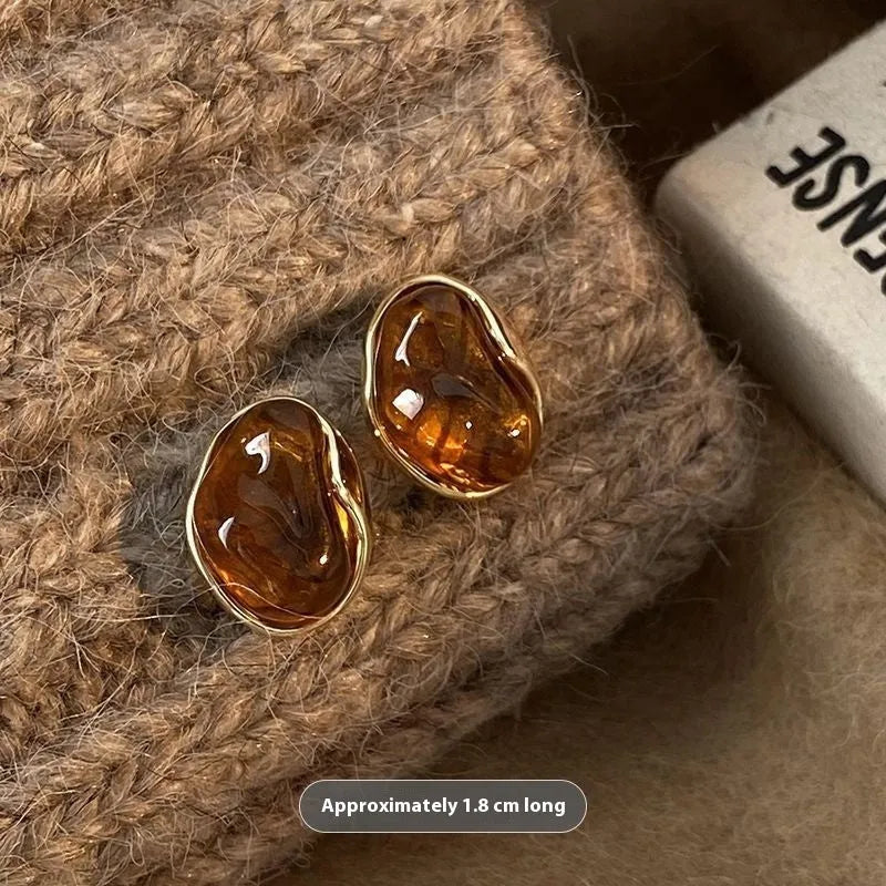 Three pairs of handmade geometric alloy earrings with tassels in Maillard, Amber, and Tigereye styles.