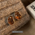 Three pairs of handmade geometric alloy earrings with tassels in Maillard, Amber, and Tigereye styles.