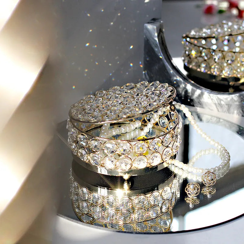 Transparent crystal glass jewelry box with a French gold metal frame in a European style.